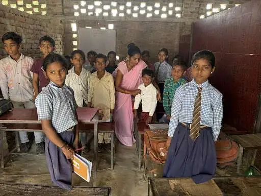 Students and teacher in rural Indian school classroom