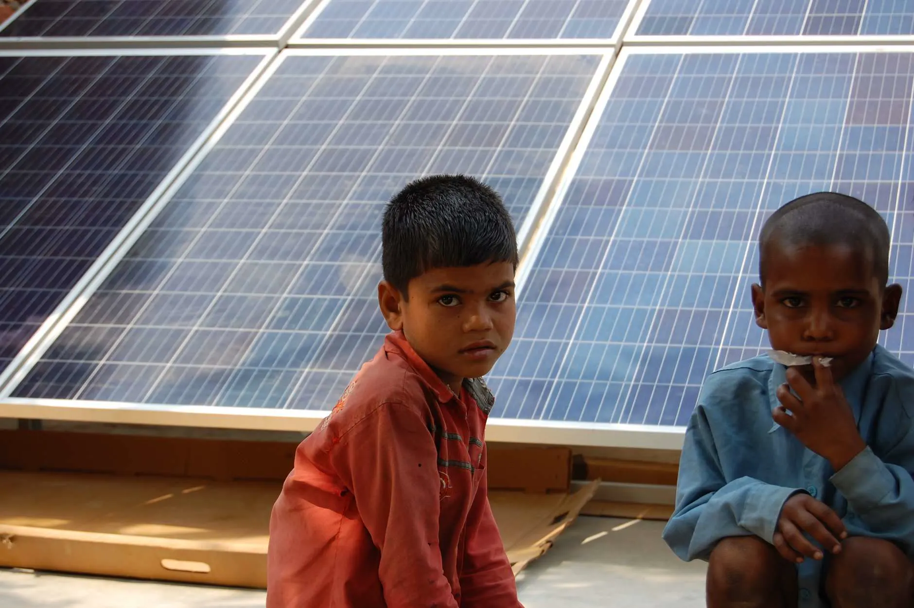 Two children at a rural school energized by Solar Village Project