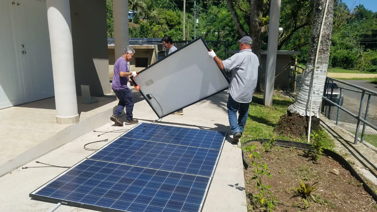 Families gathered inside a solar-powered resilience hub in Puerto Rico