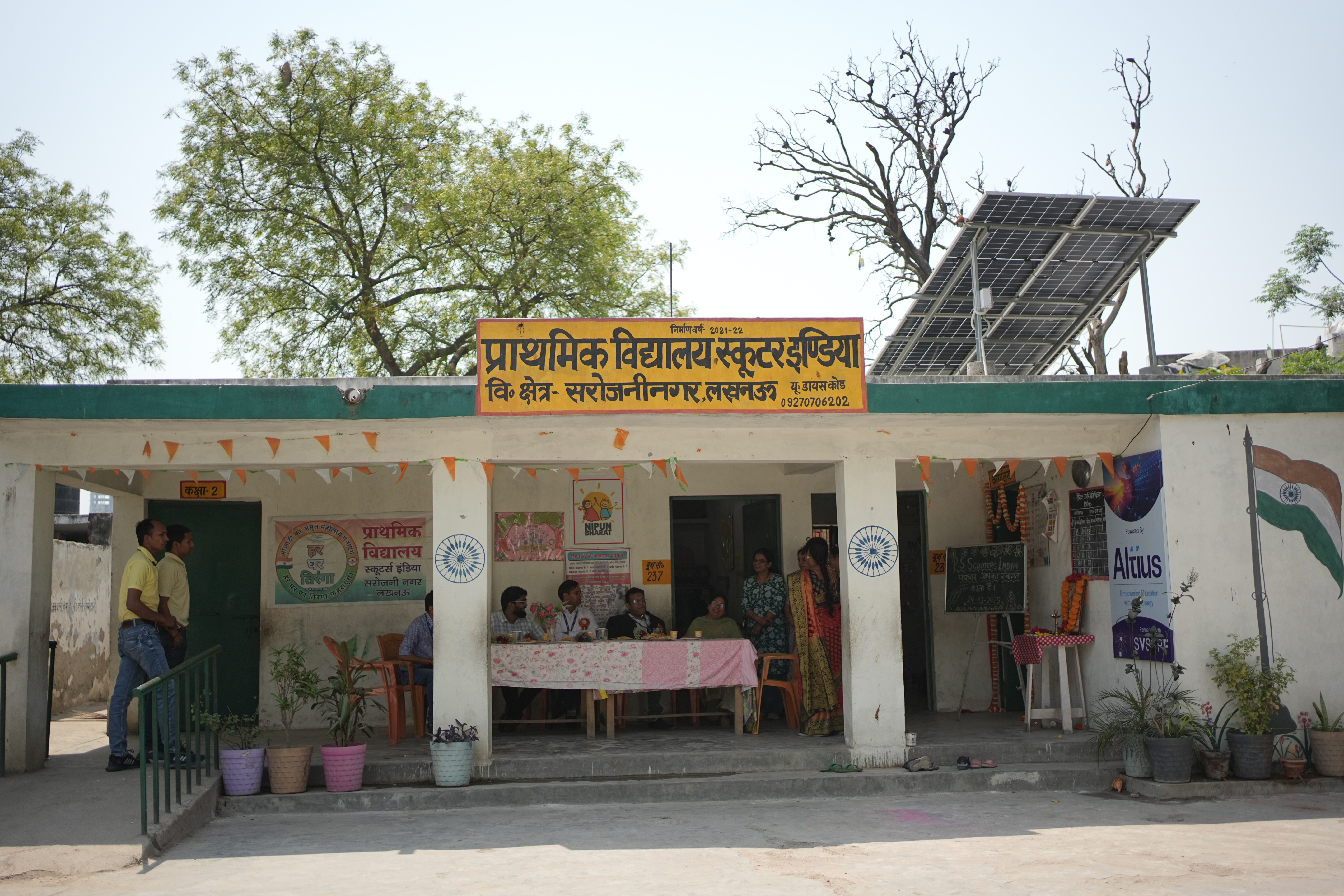 Children at the entrance of a rural school with rooftop solar