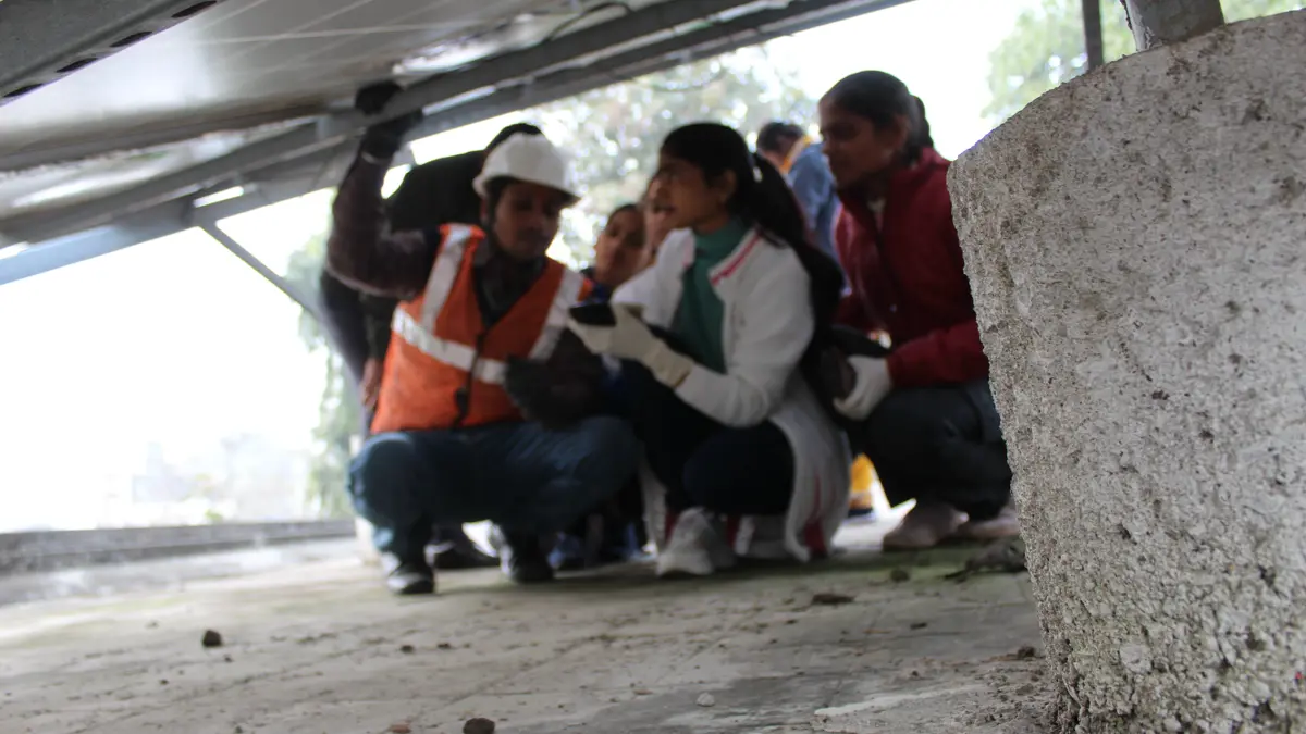 Women participating in hands-on solar technical training